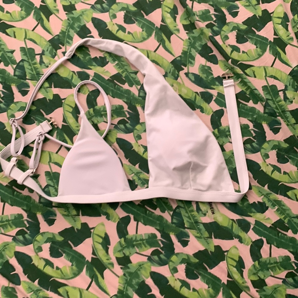 One shoulder white swim suit top.
